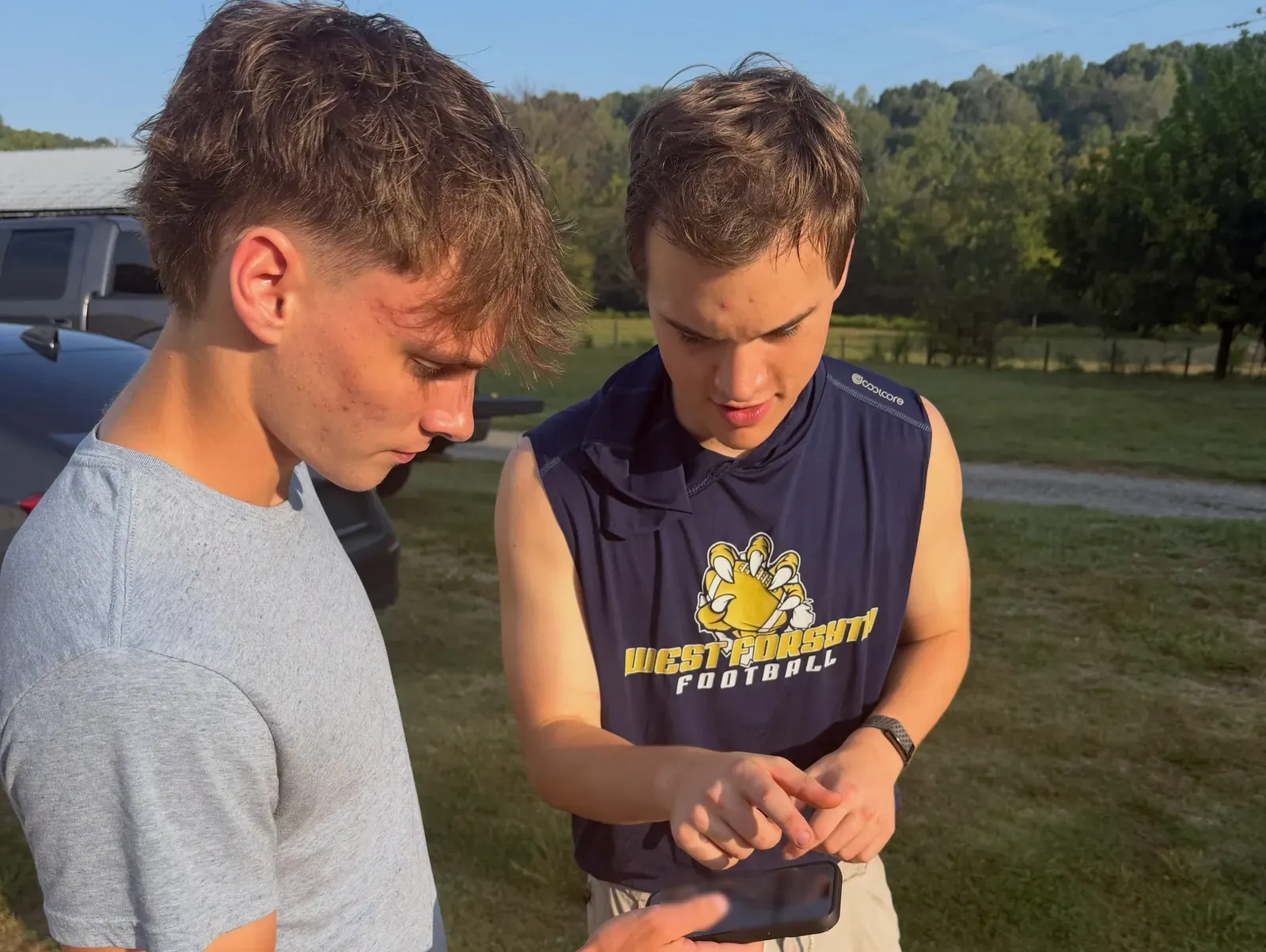 Two crew members going over a delivery on the driver app